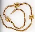 A swastika necklace excavated from Marlik, Gilan province, northern Iran, circa 1,200–1,050 BCE