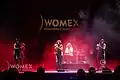 Tanxugueiras are a Galician folk trio formed in 2016. The group aim to bring a modern sound to traditional Galician music by merging folk sounds with pop and world music influences. Their music focuses on themes such as the understanding between peoples, the defence of the Galician language and culture, and women's empowerment.