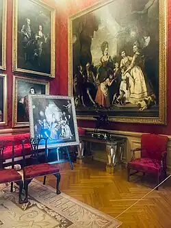 The Red Drawing Room with The Marlborough Family by Sir Joshua Reynolds in situ. Ellis Waterhouse described the painting as 'the most monumental achievement of British portraiture.'[35]