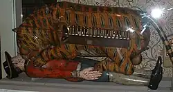 Side view, showing how the handle when turned gets in the way of the player of the keyboard