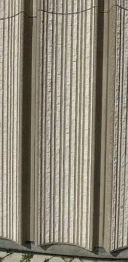textured grey wall of interlocked panels