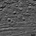 Vestan craters in various states of degradation, with troughs at bottom (6 August 2011)