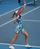 Elena Rybakina serving a tennis ball at the 2024 Brisbane International