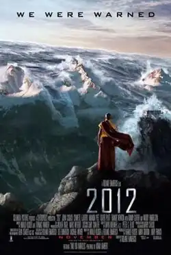 Film poster showing a Nepalese monk on a mountain watching as tsumani waves coming over the Himalayan mountains, with the film's credits, title, and release date at the bottom and tagline above reading. "We were warned."