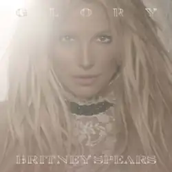 The album's original cover; featuring a close-up image of Spears with a bright light in the background. The album title is written on top of the image, while Spears's name is written below her image.