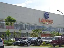 Front of large store, with cars in foreground