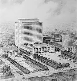 picture of tall building with small buildings and open square in front