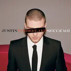 Cover art for "SexyBack": A young man with a buzz cut wears a two-piece black suit with a white shirt and black tie. A black horizontal rectangle covers his left eye, while his right blue eye can be seen. In capitals, "Justin", "Timberlake", and "SexyBack" are written in black, orange, and white font, respectively. The word "Back" is spelled backwards.