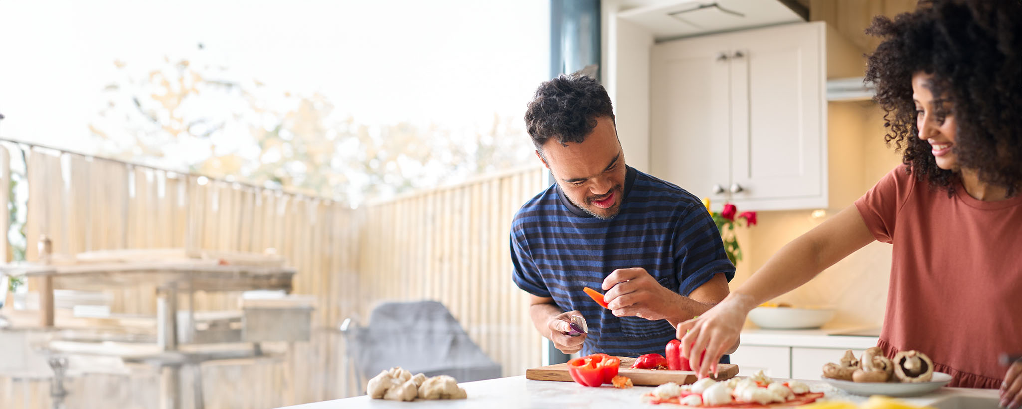 woman and disabled brother cooking 